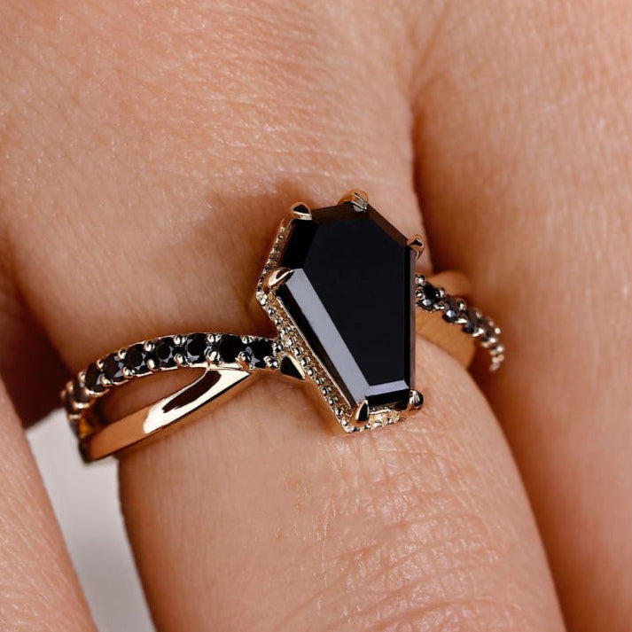 Coffin cut engagement ring with a unique and stunning design.
