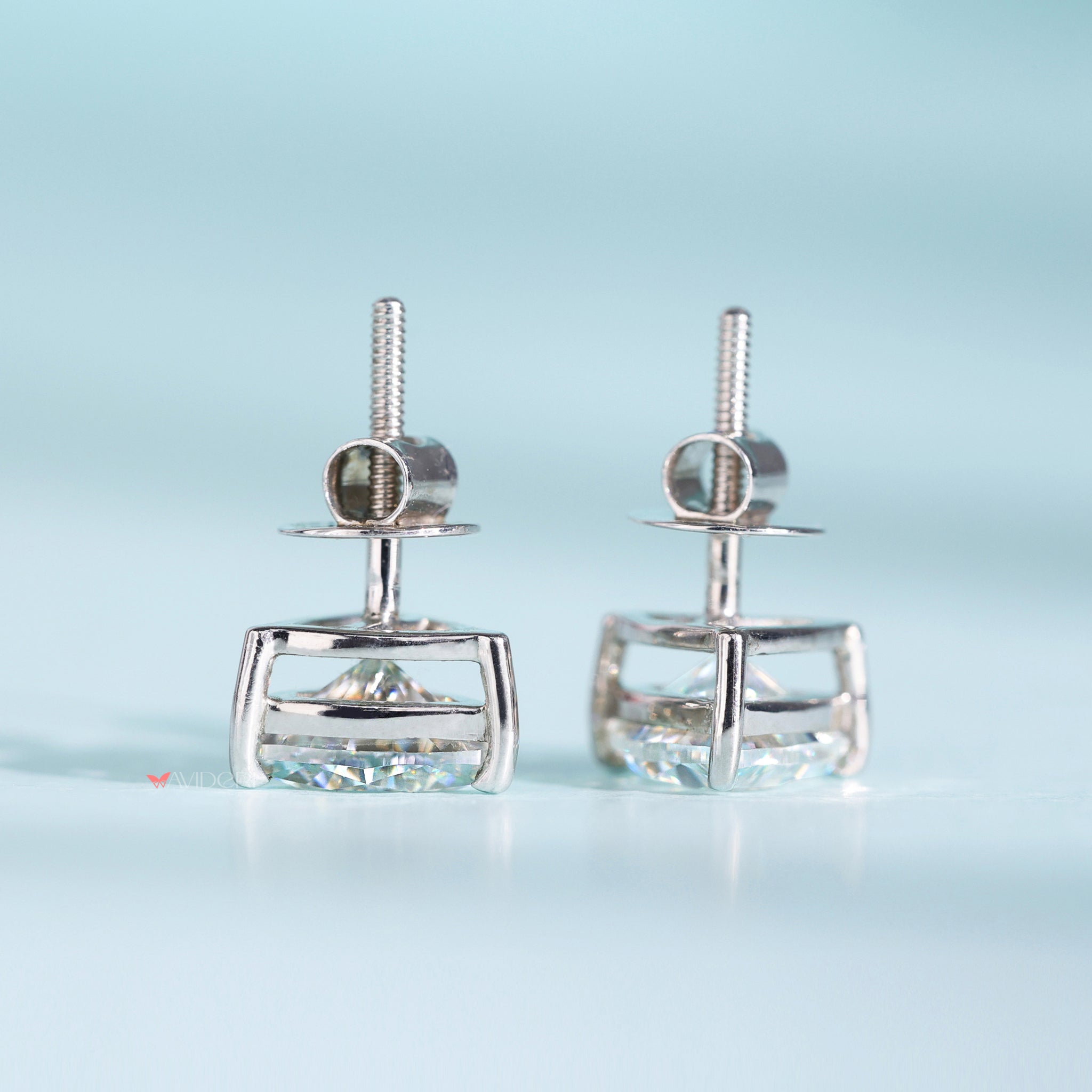 White gold earrings provide a cool, sleek finish.