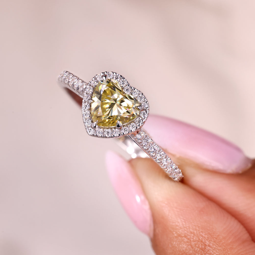 Round moissanite halo heart cut ring design.