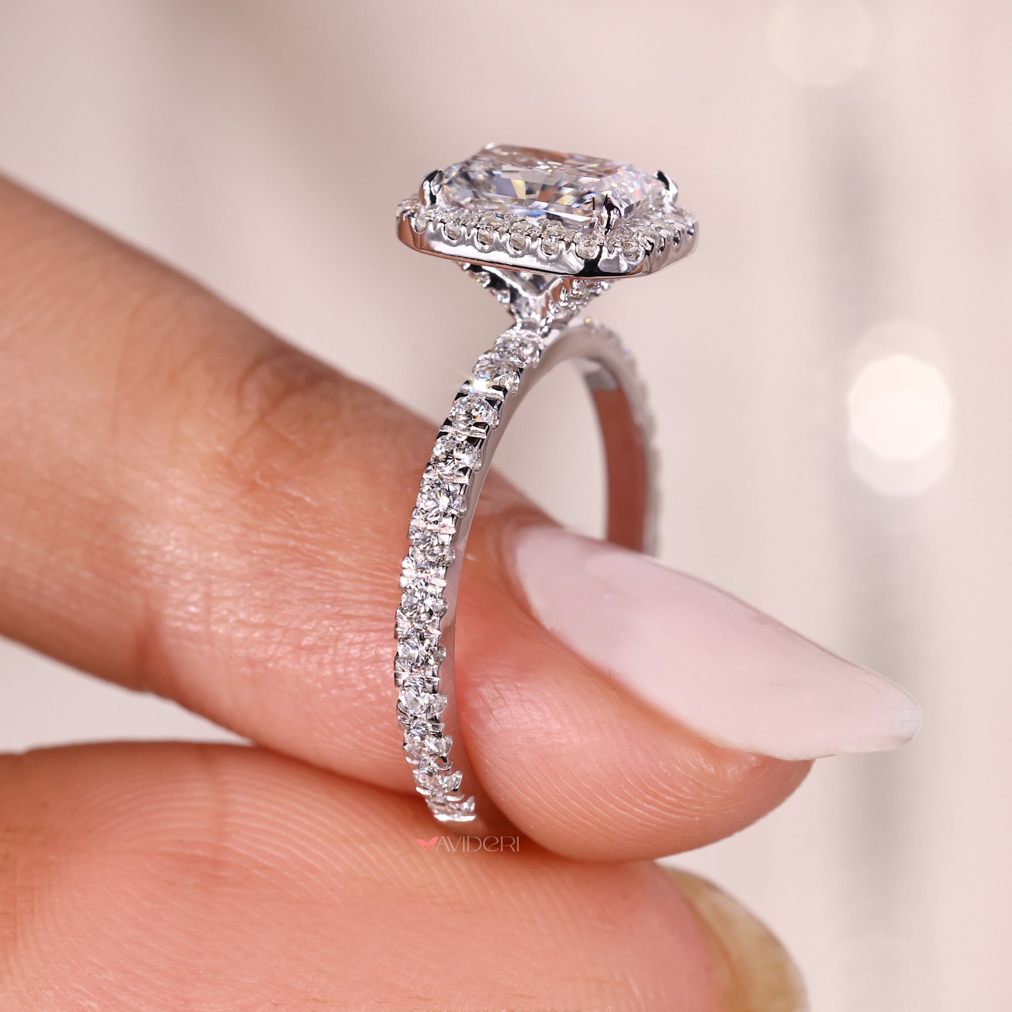 Pave diamond engagement ring with radiant center stone.