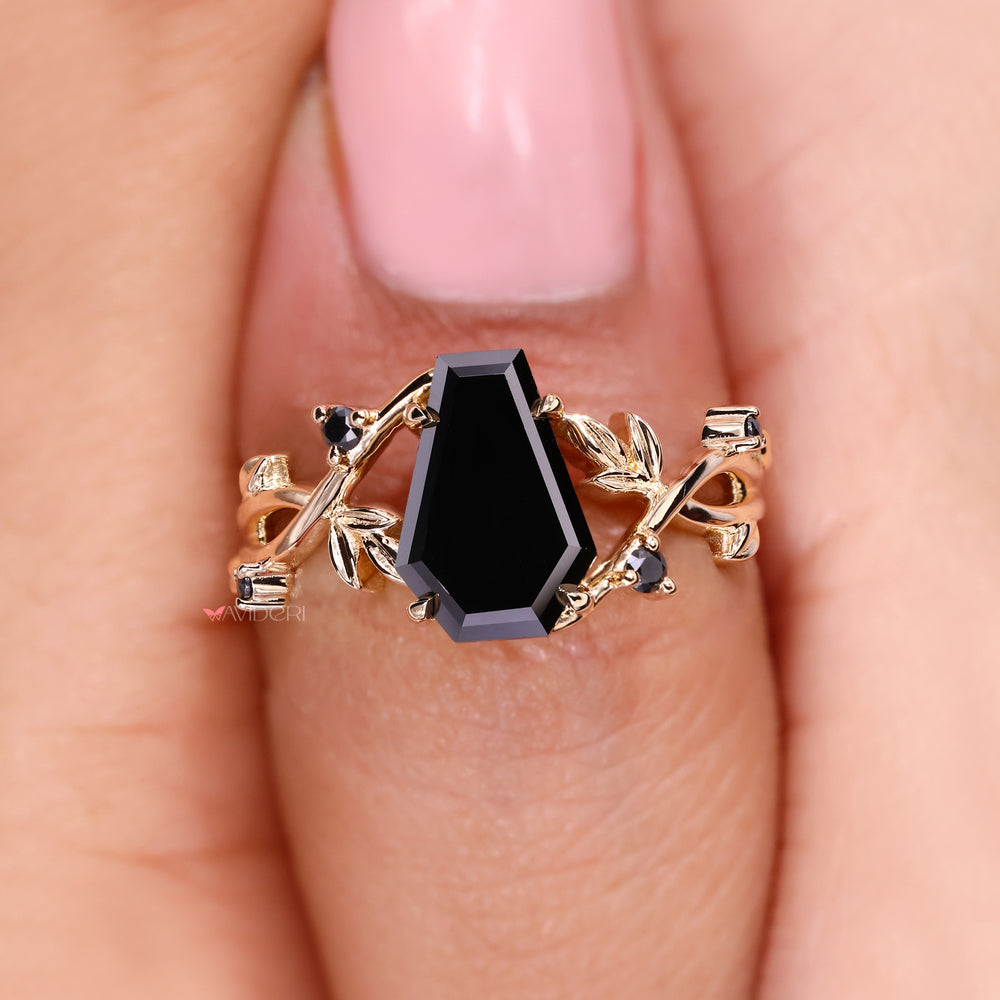 Handmade ring featuring a coffin cut center stone.