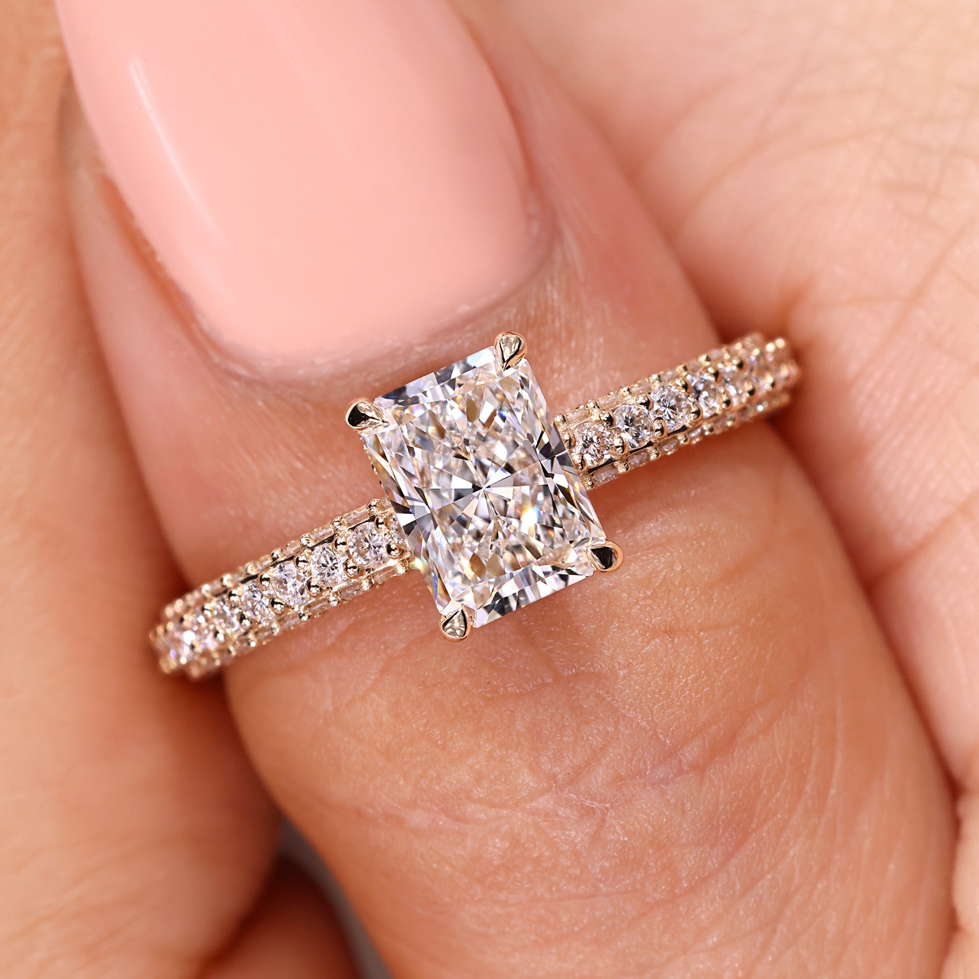 Handmade jewelry with radiant diamond engagement ring.