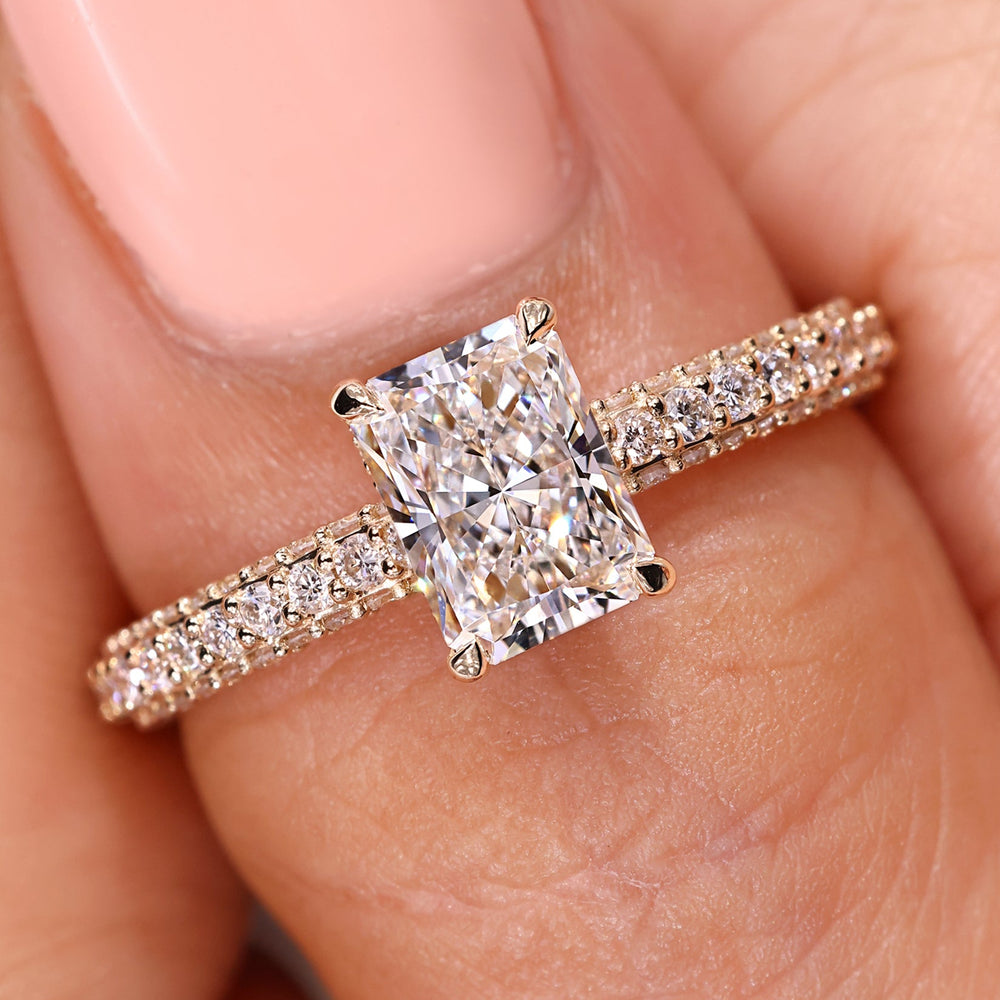 Handmade jewelry with radiant diamond engagement ring.