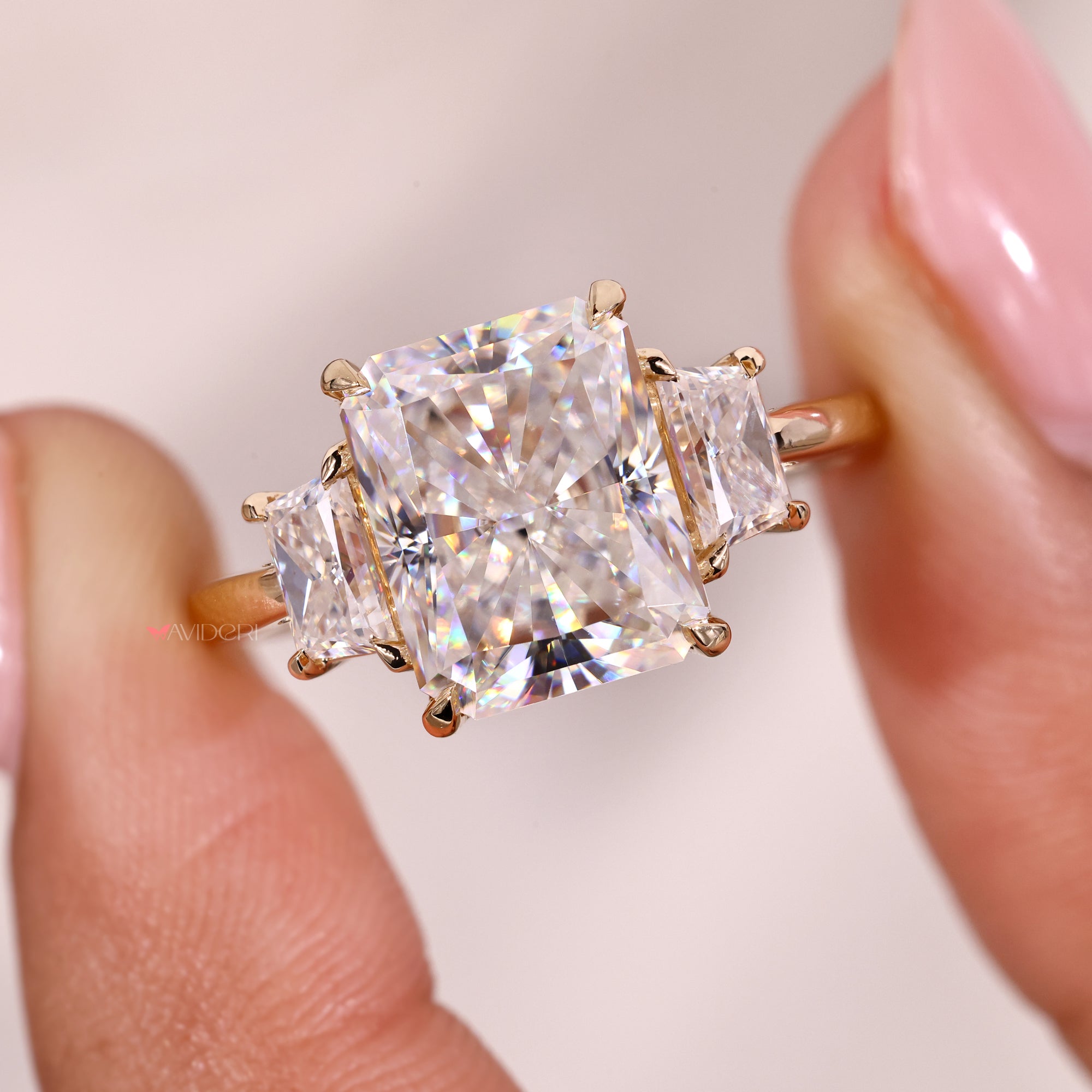 Handmade ring with trapezoid cut side moissanite.