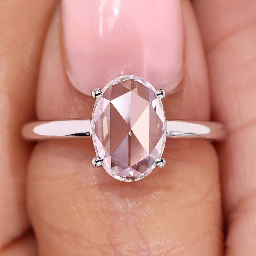 Oval rose cut engagement ring with simple engagement ring.