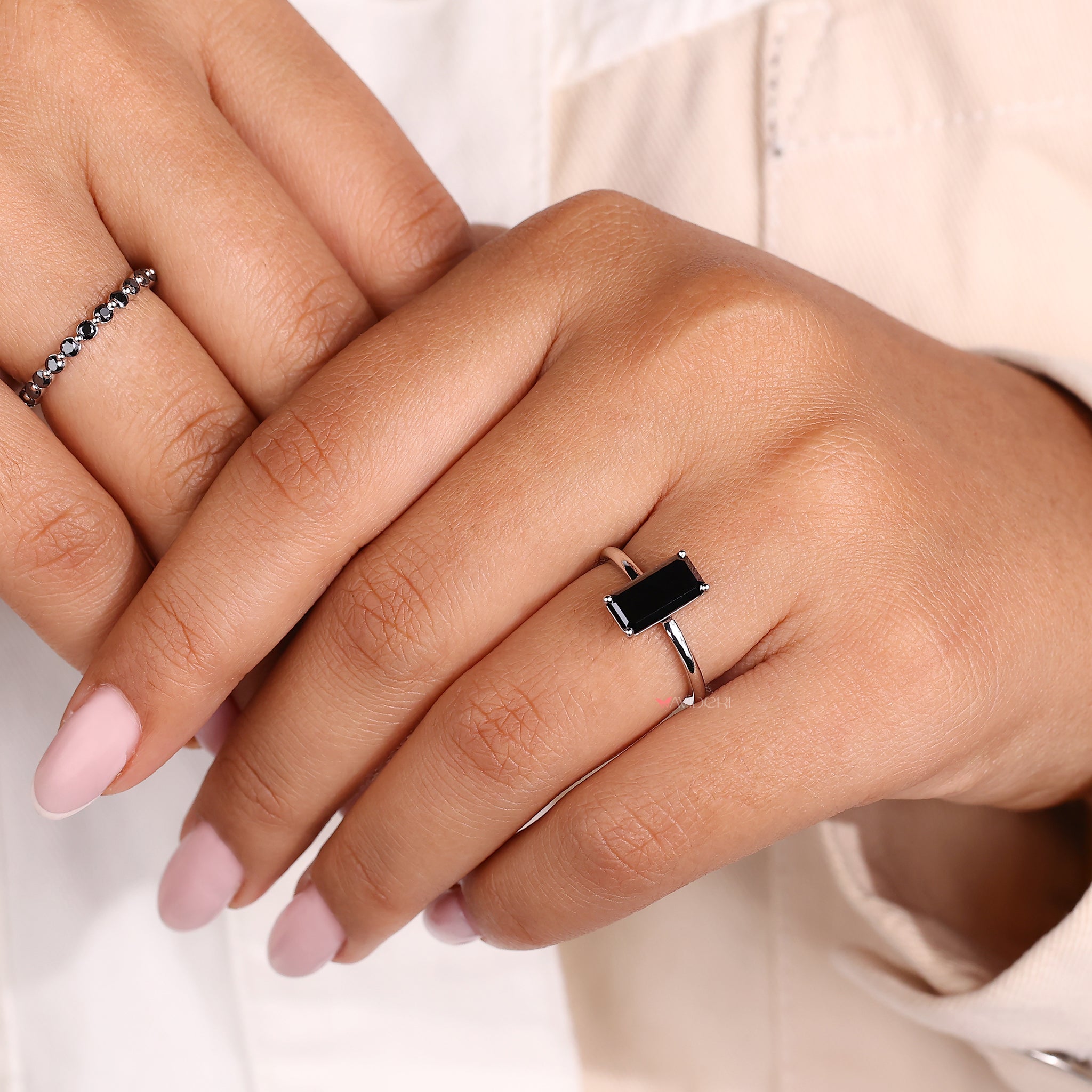 Emerald Portrait ring set in a white gold band.