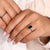Emerald Portrait ring set in a white gold band.