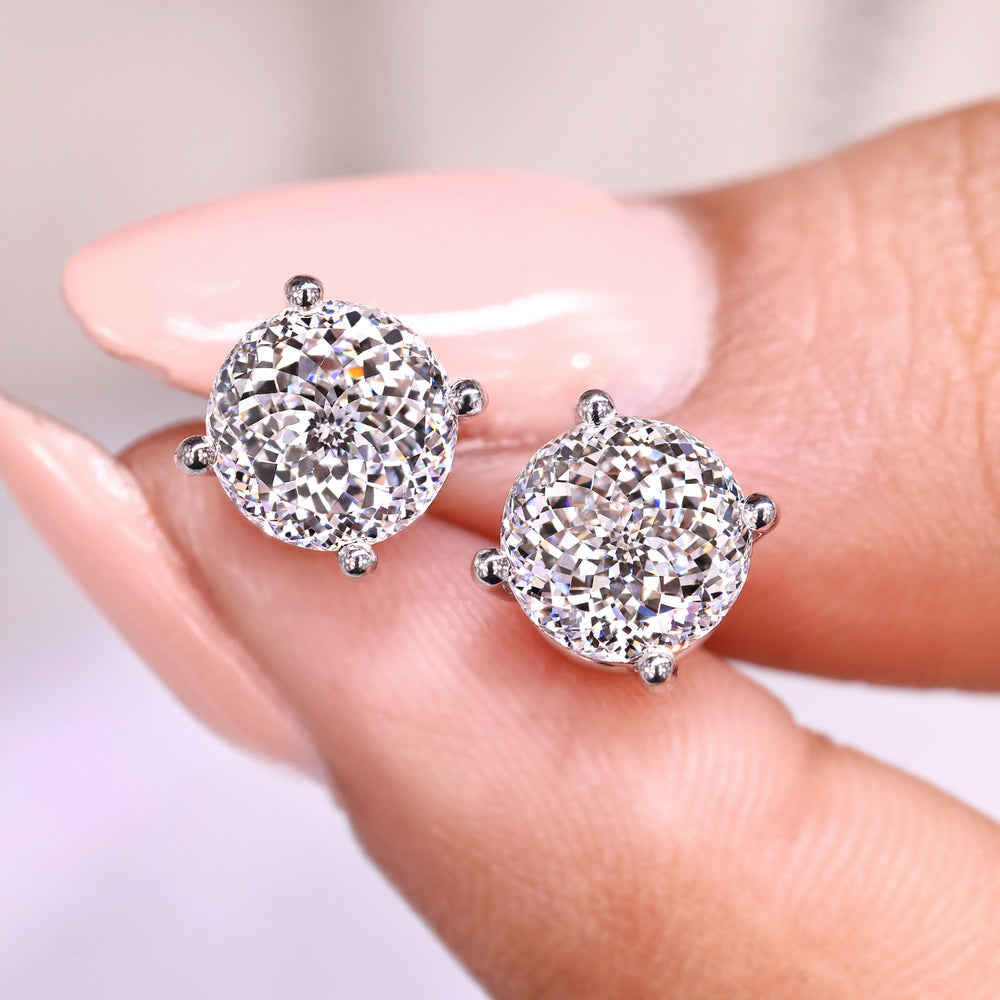 Portuguese cut diamond earrings with 4 prong setting.
