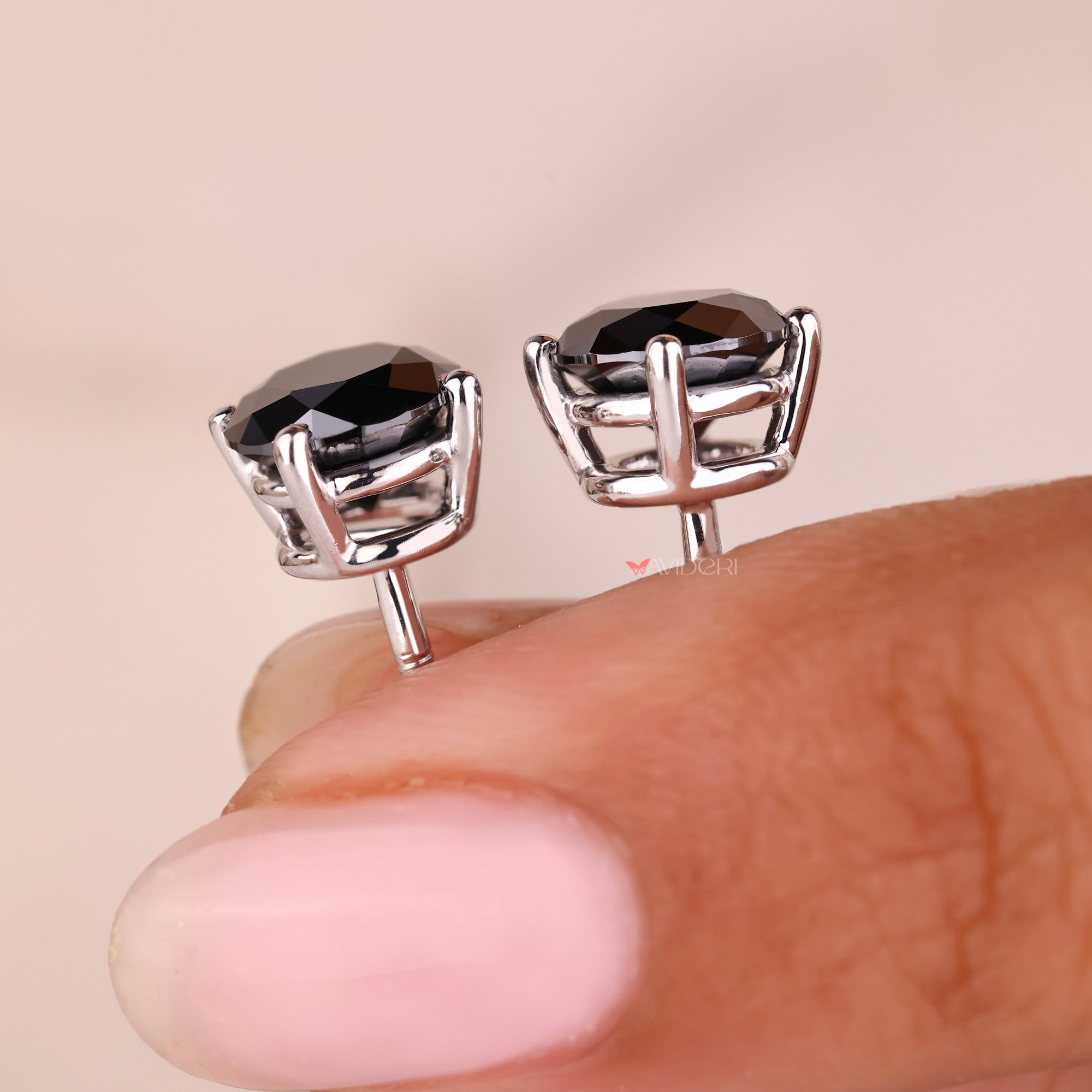 Handmade jewelry featuring stunning white gold stud earrings with moissanite.