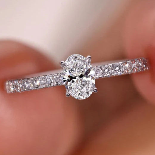 Oval engagement ring with a lab-grown diamond.

