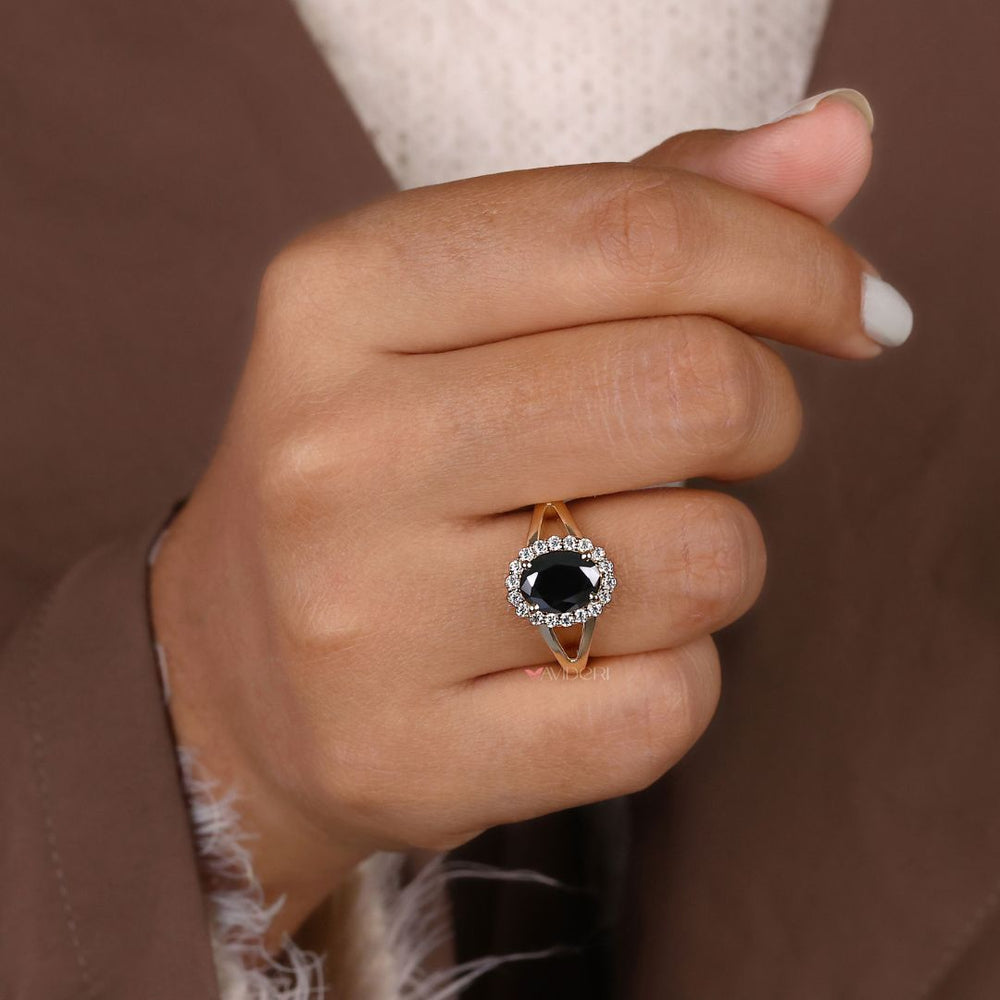 Halo engagement ring with sparkling accents around the center stone.

