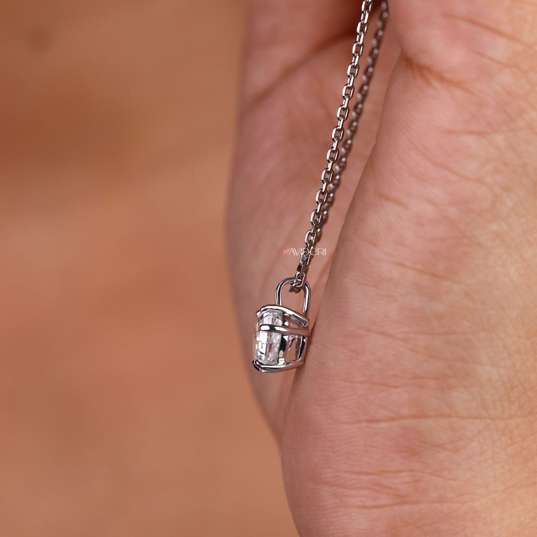 By gold pendant designed with a smooth finish.
