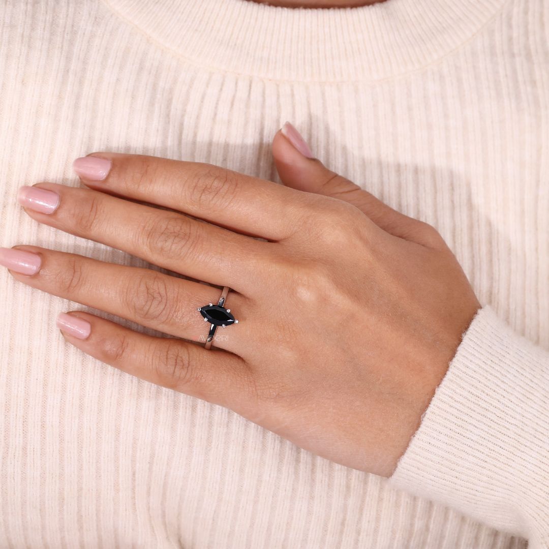 Marquise moissanite promise ring set in a classic white gold band.

