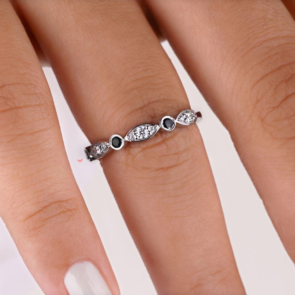Black round wedding band showcases bold, dark moissanite stones for an edgy, modern look.
