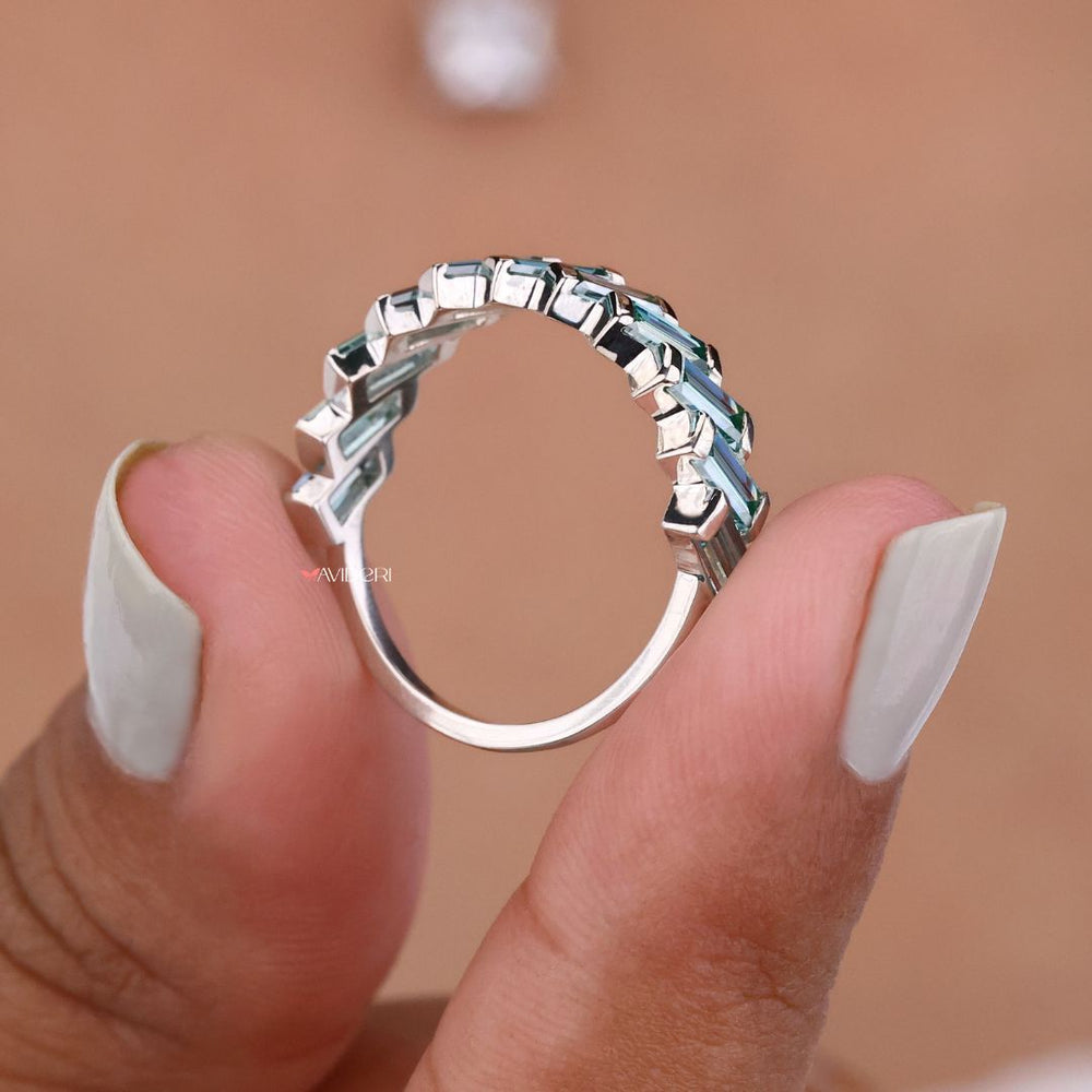 Half eternity wedding band features stones set halfway around the band for subtle elegance.
