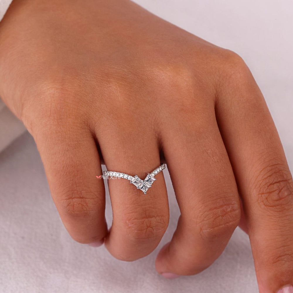 Princess and round wedding band blends modern princess cuts with classic round stones.
