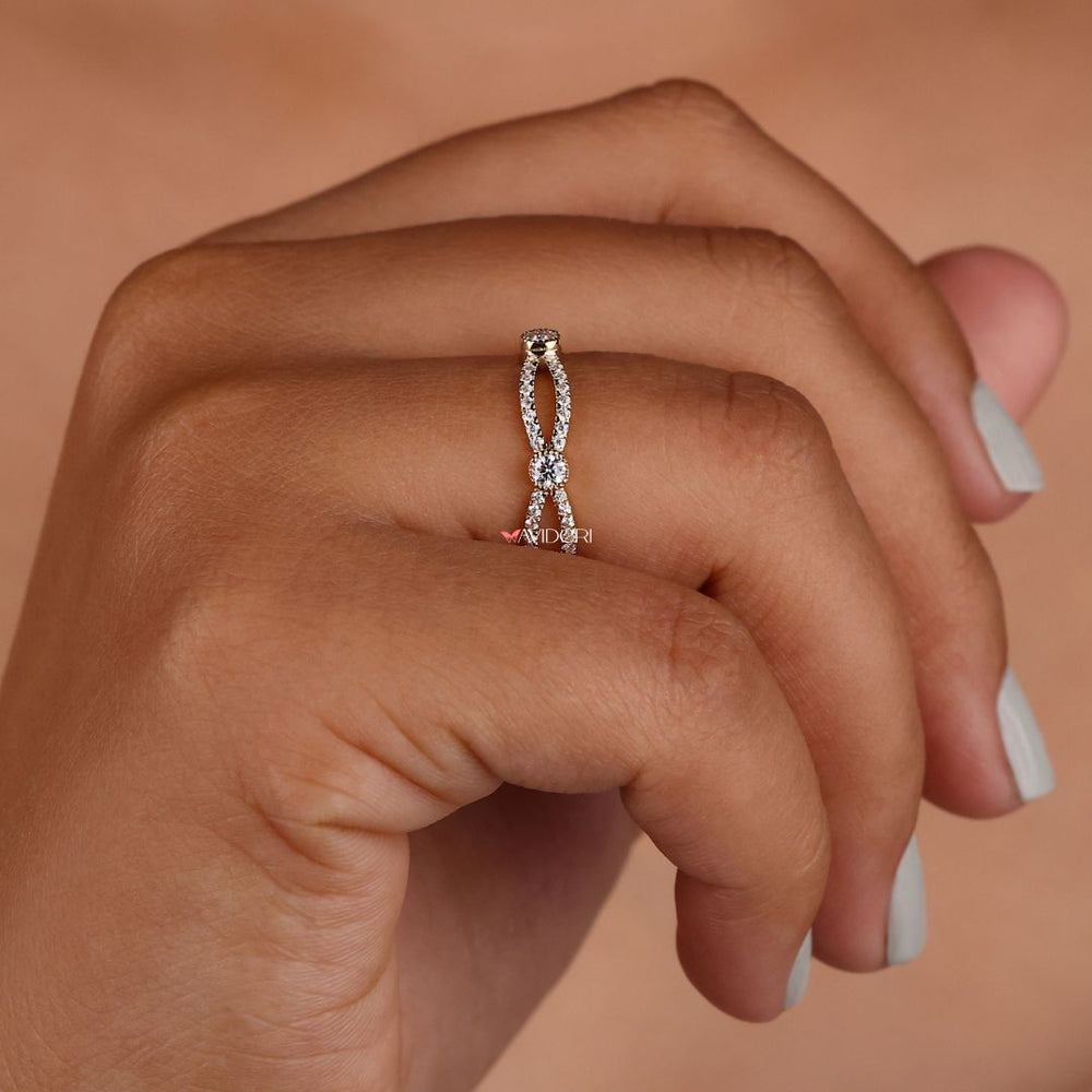 Infinity design band symbolizes eternal love with a continuous loop of sparkling stones.
