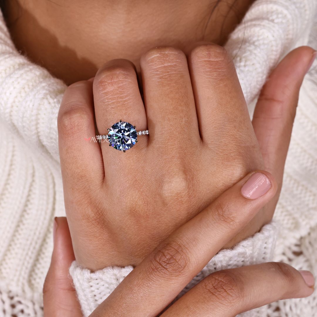 A claw prong setting enhances the diamond’s shape with vintage charm.
