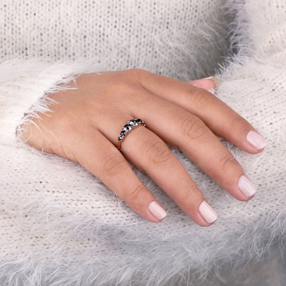Prong setting band featuring round cut diamonds in a sleek design.

