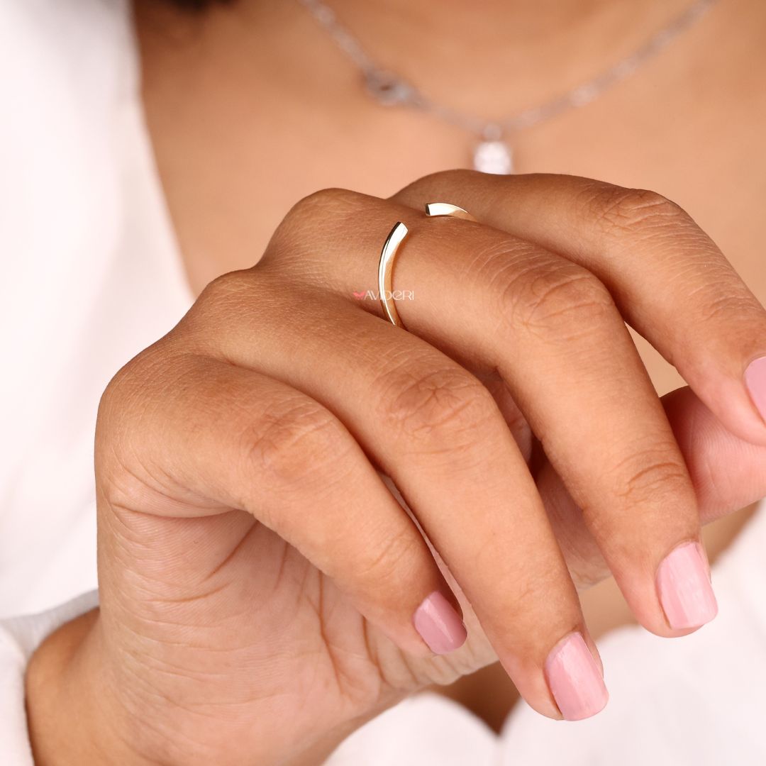 The yellow gold wedding band adds warmth and shine.
