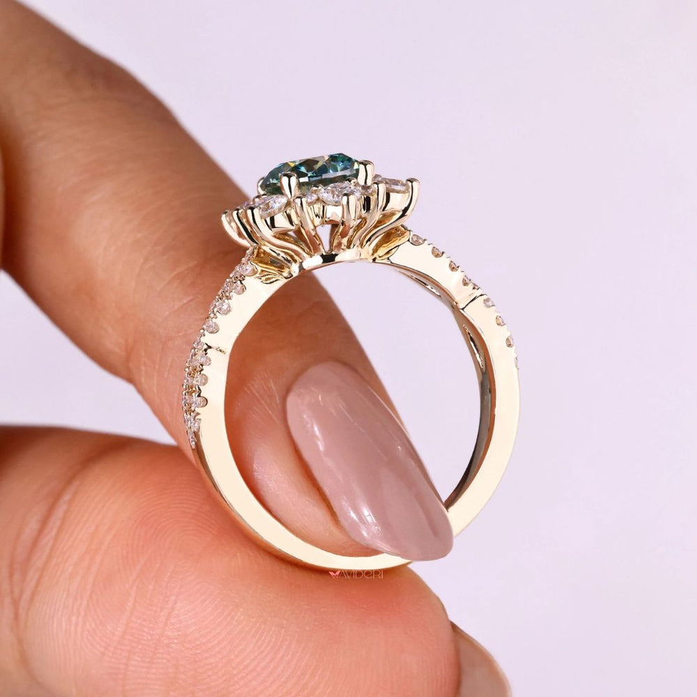 White gold ring featuring a round cut engagement ring with a flower style halo ring.

