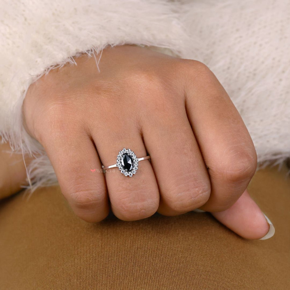 Handmade ring with an oval cut moissanite, perfect for your engagement.
