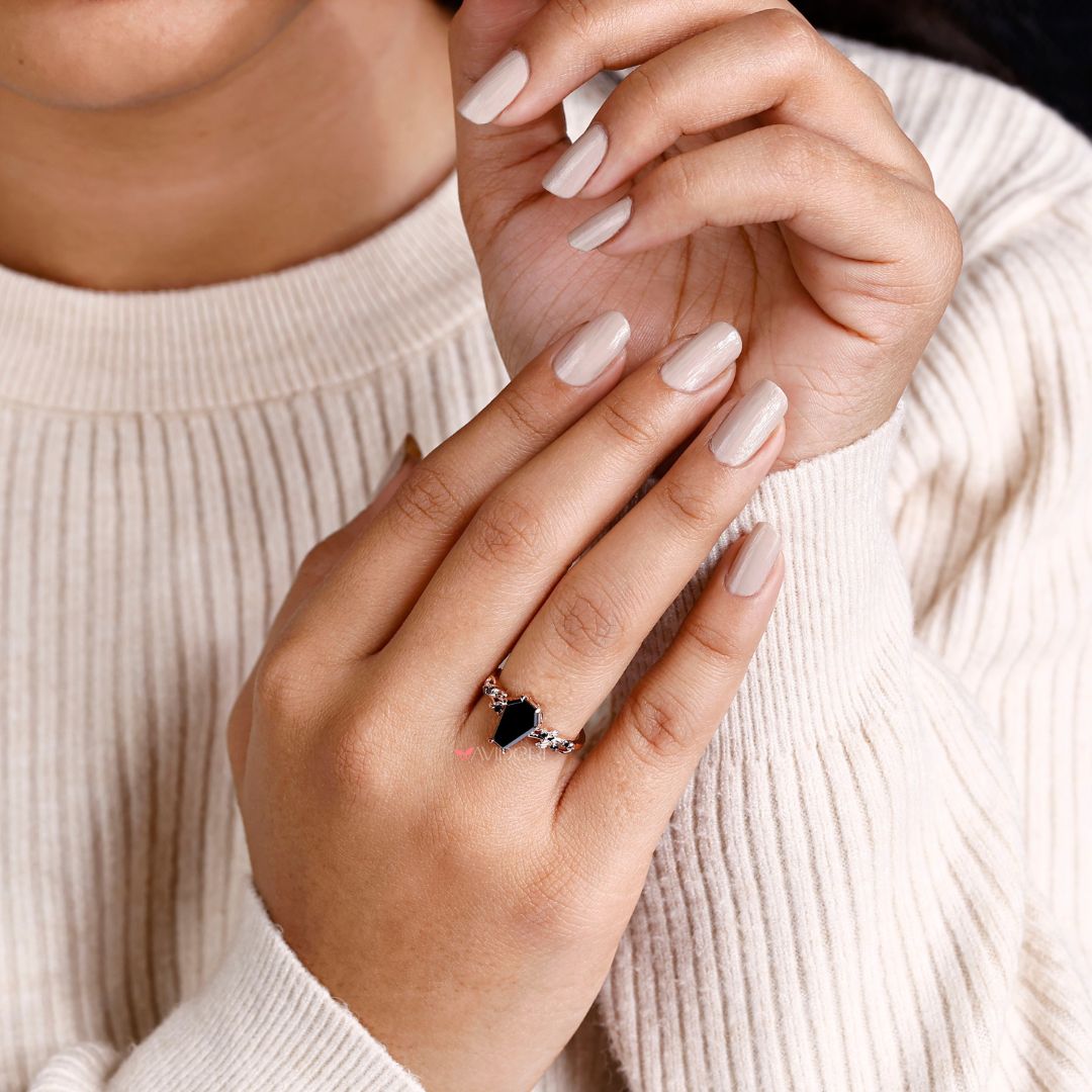 Vintage ring with a classic coffin engagement ring design.
