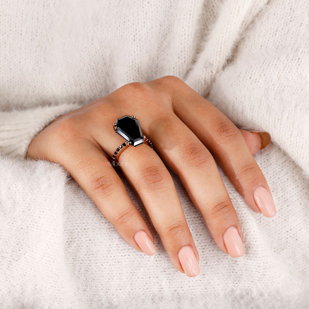 Handmade jewelry featuring a bold coffin engagement ring design.

