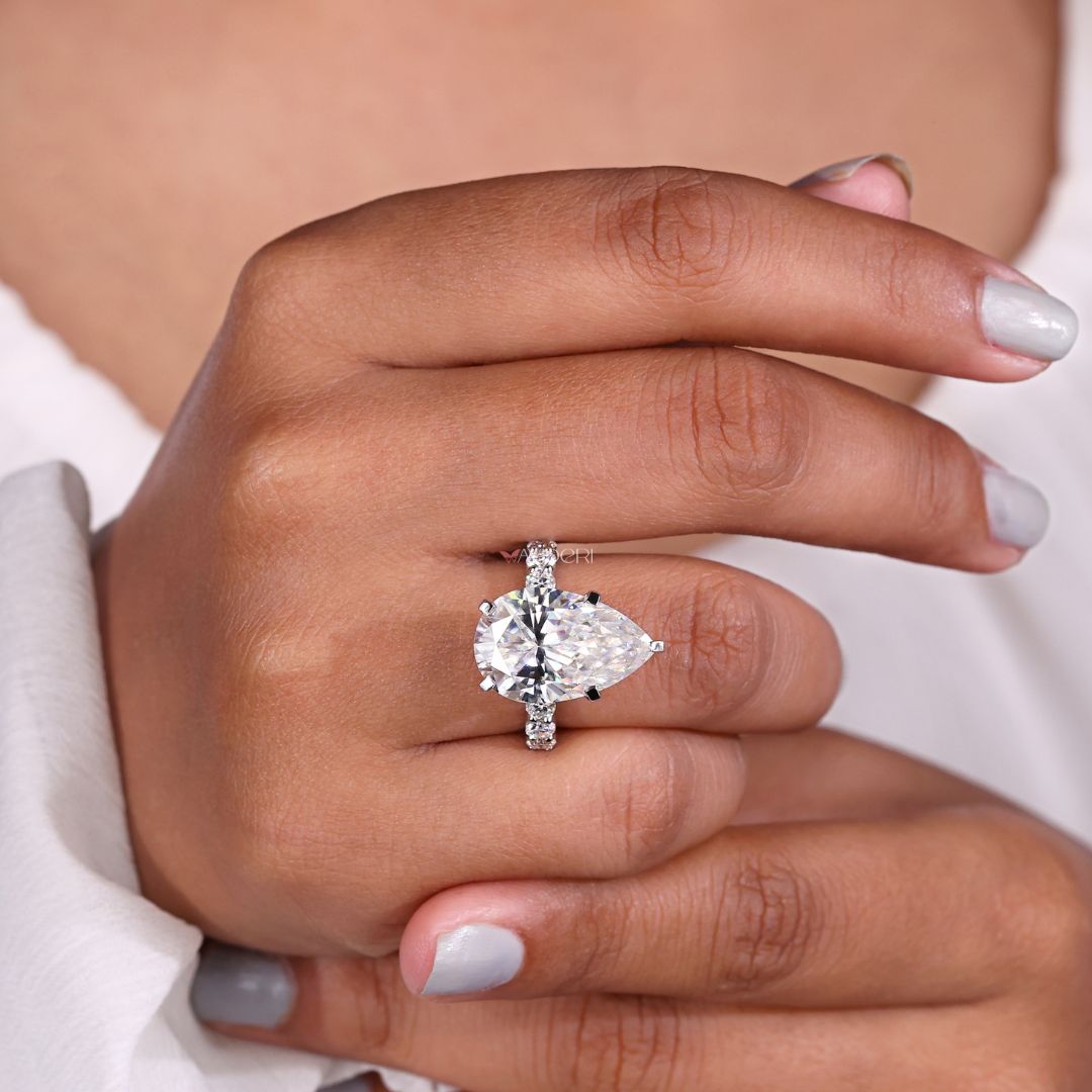 Round cut pave set engagement ring in white gold.
