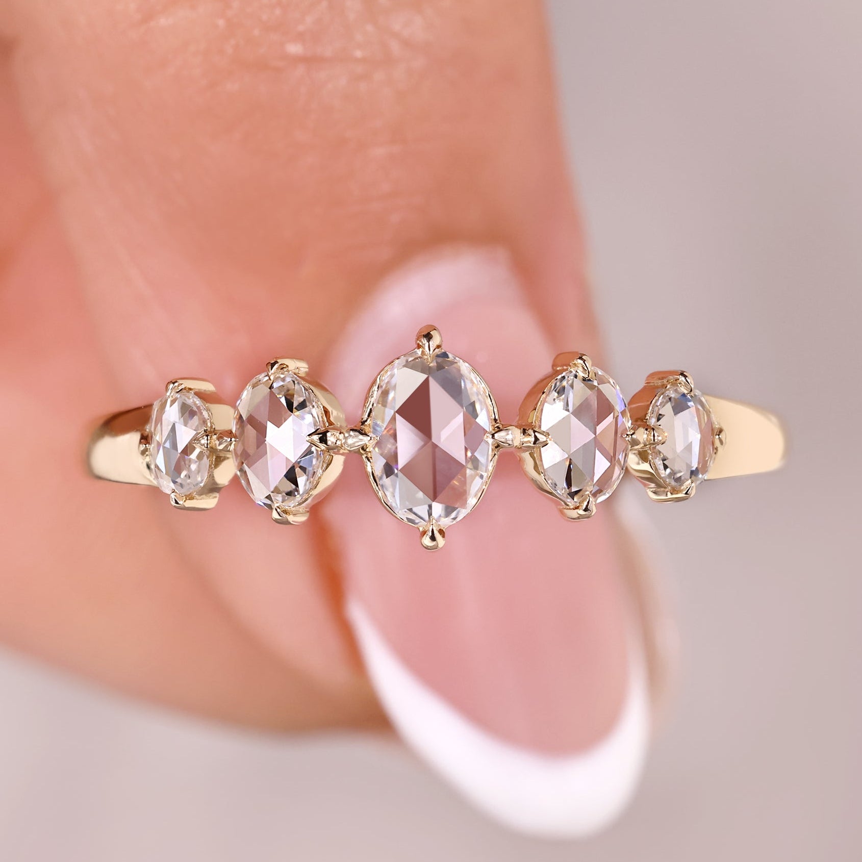 5 stone wedding band with oval rose cut diamond band.