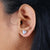 Handmade earrings showcase fine craftsmanship and detail.