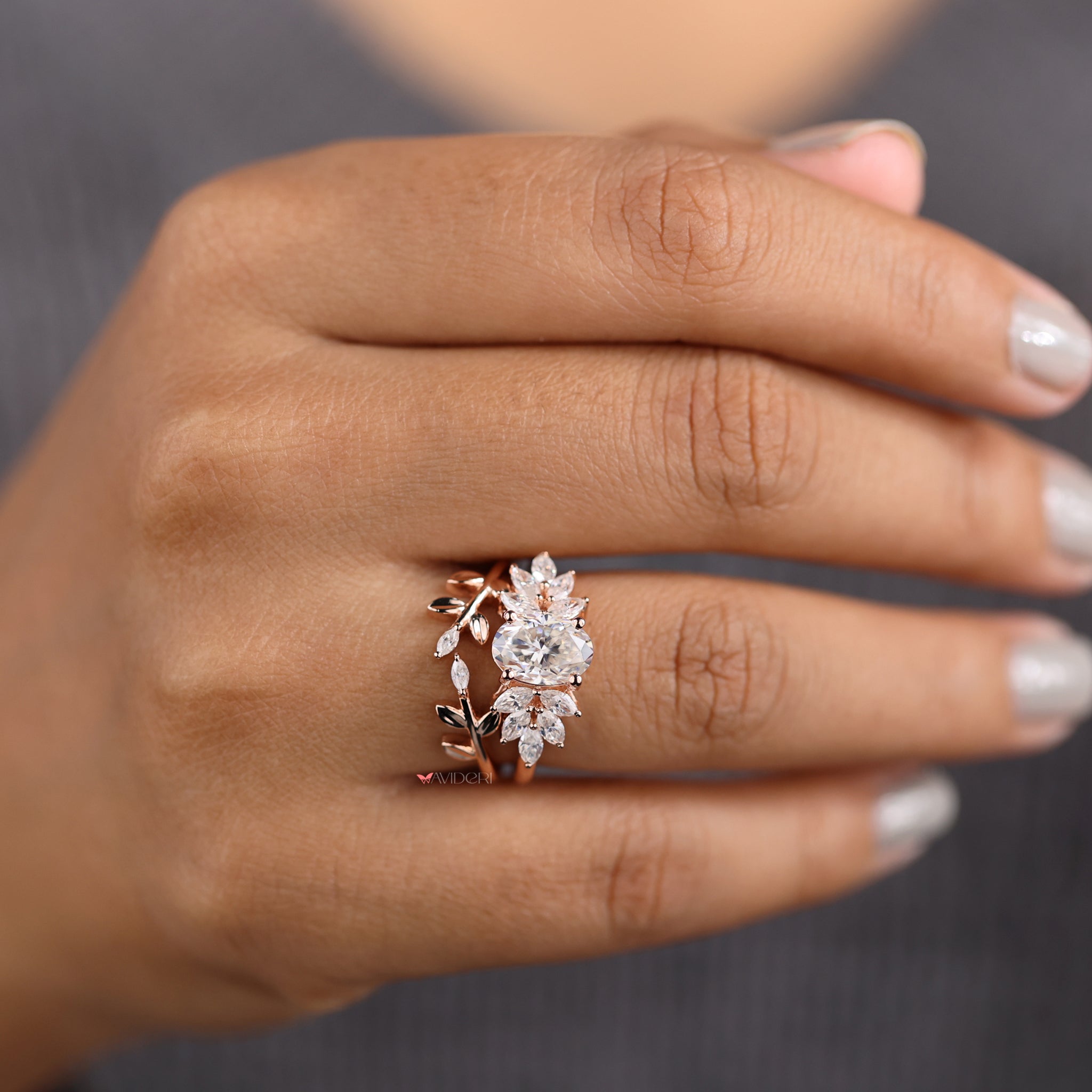 Open gap wedding band with a marquise and oval cut design.
