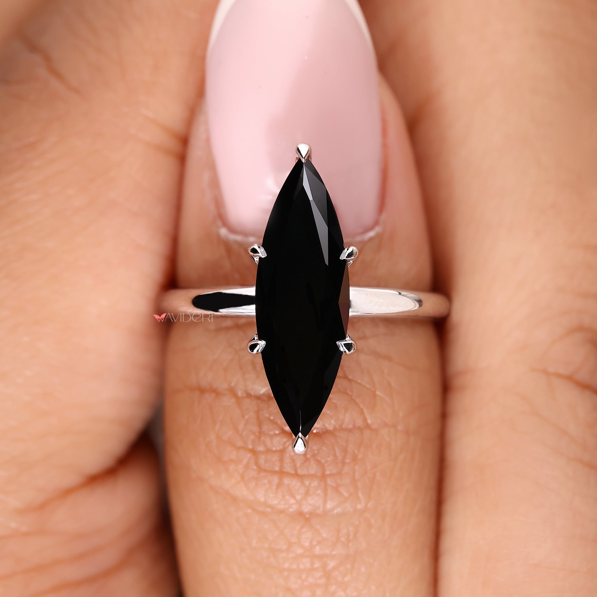 Handmade jewelry showcasing a marquise cut stone.