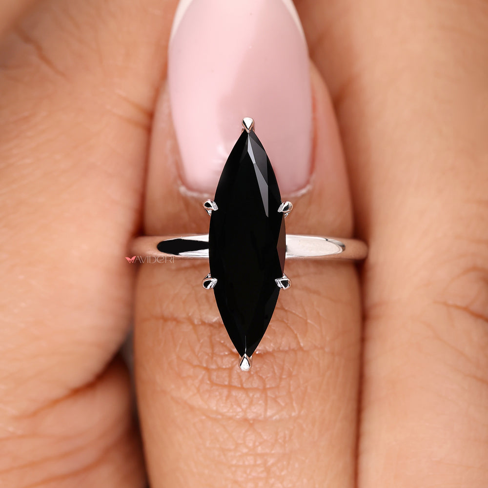 Handmade jewelry showcasing a marquise cut stone.