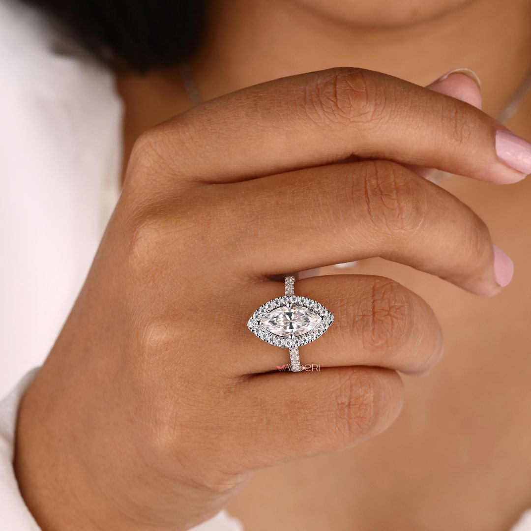 White gold ring paired with a marquise cut center
