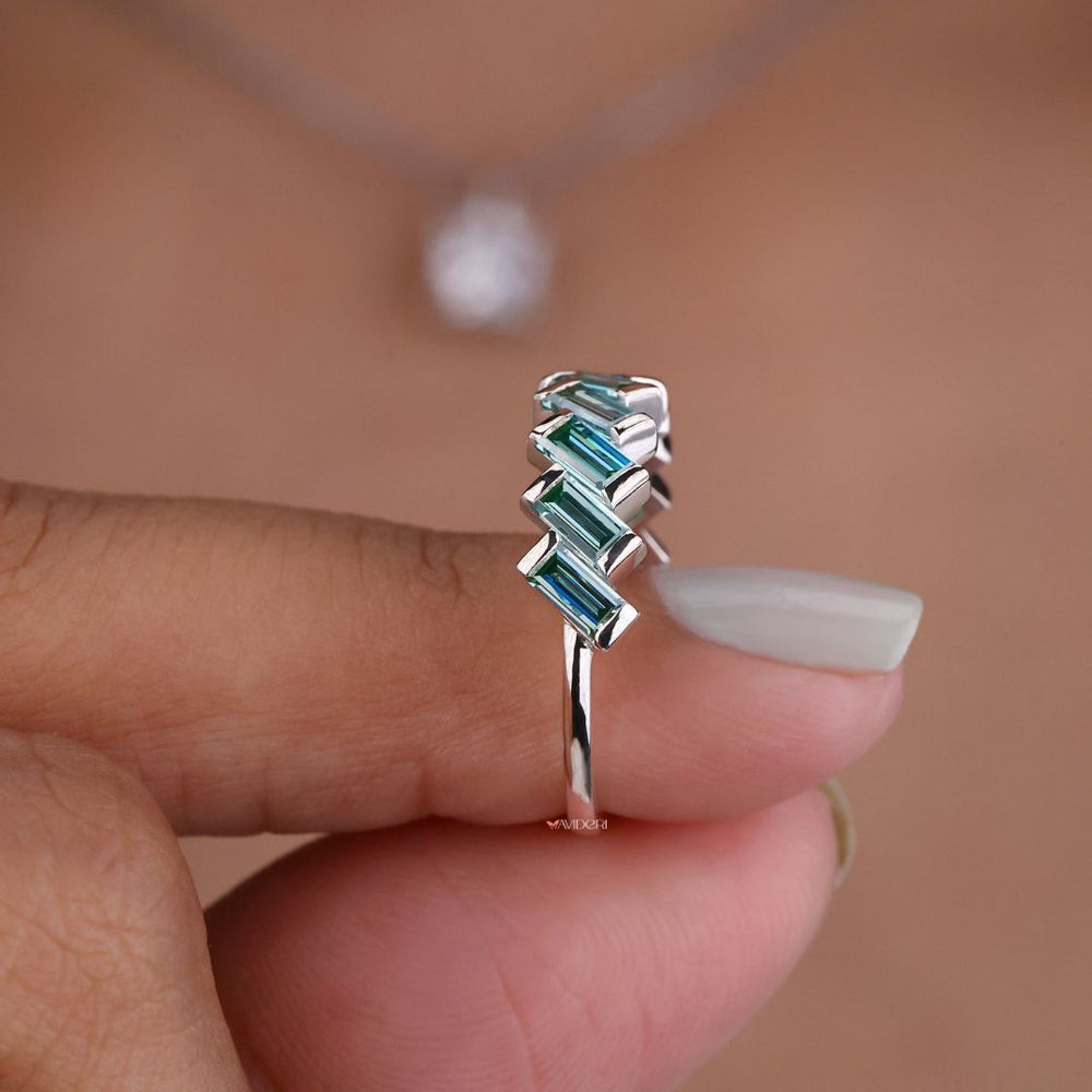 Half eternity band brings balance and shine with half the band adorned in moissanite stones.
