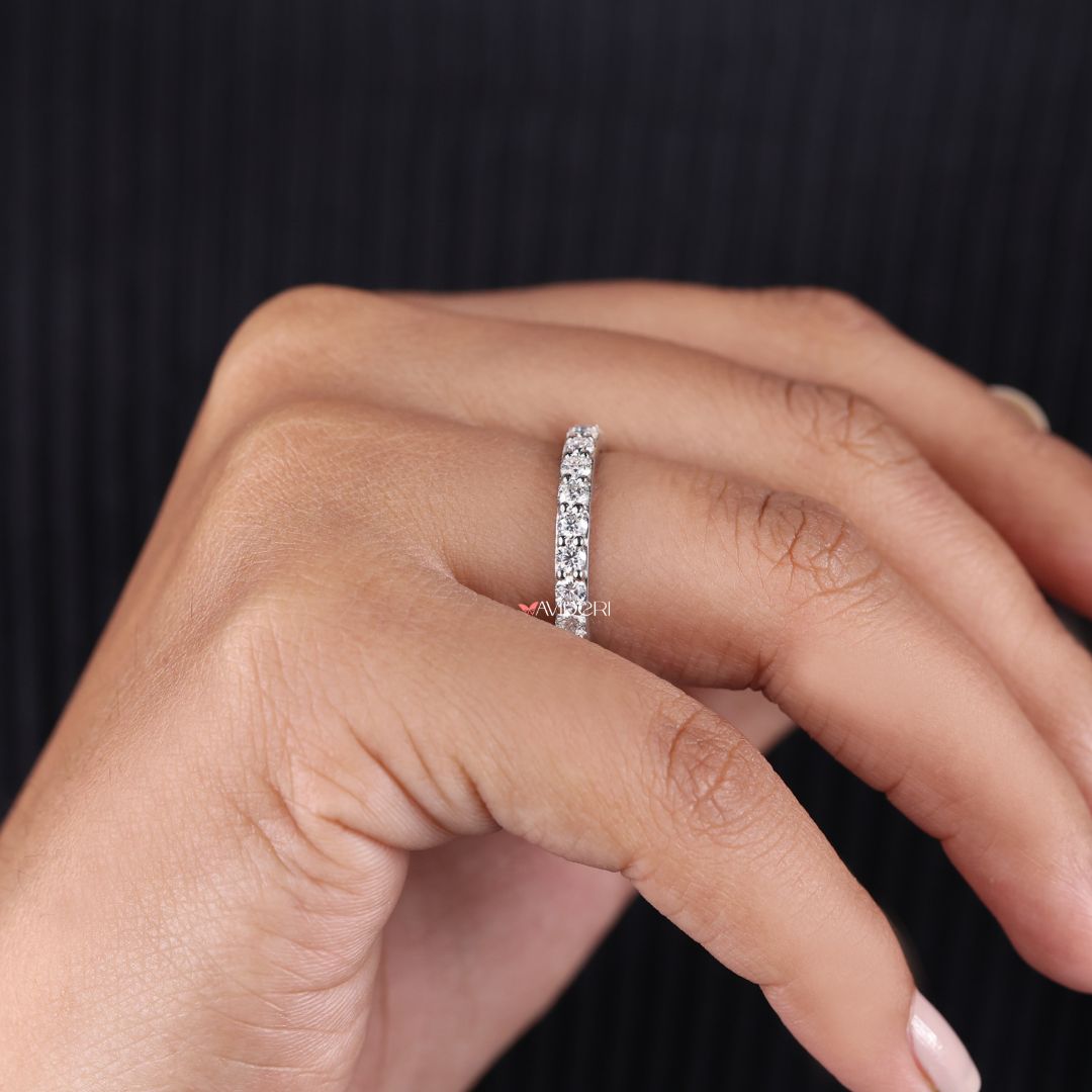 Round prong setting secures each stone while enhancing their brilliance.
