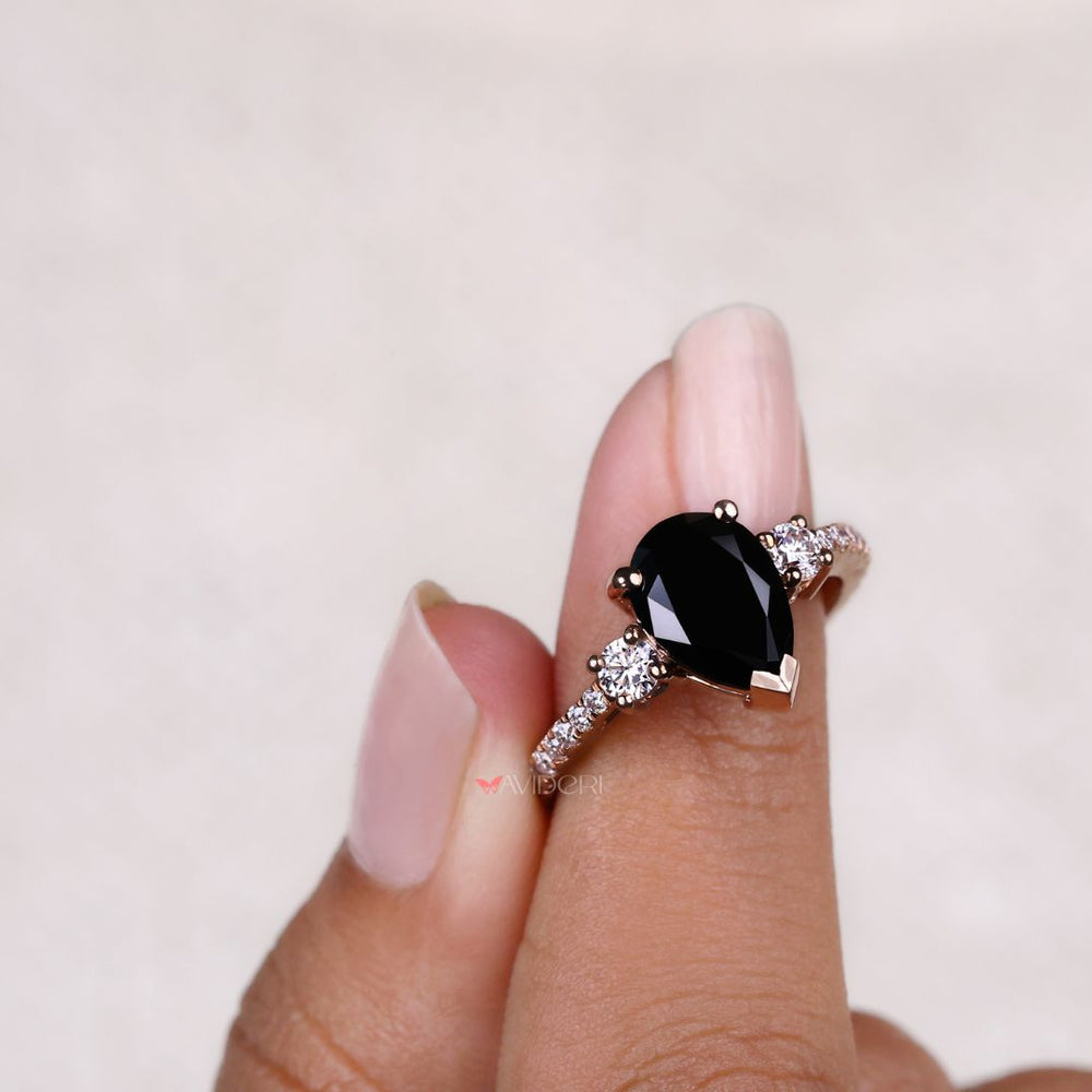 Three stone pear engagement ring crafted with precision and beauty
