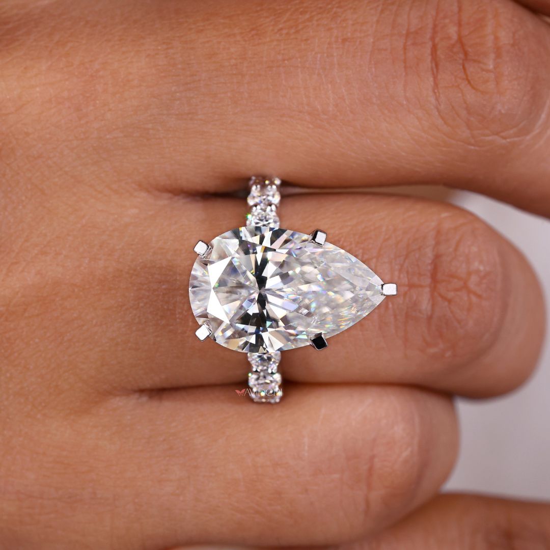 Handmade jewelry featuring a round cut pave engagement ring.
