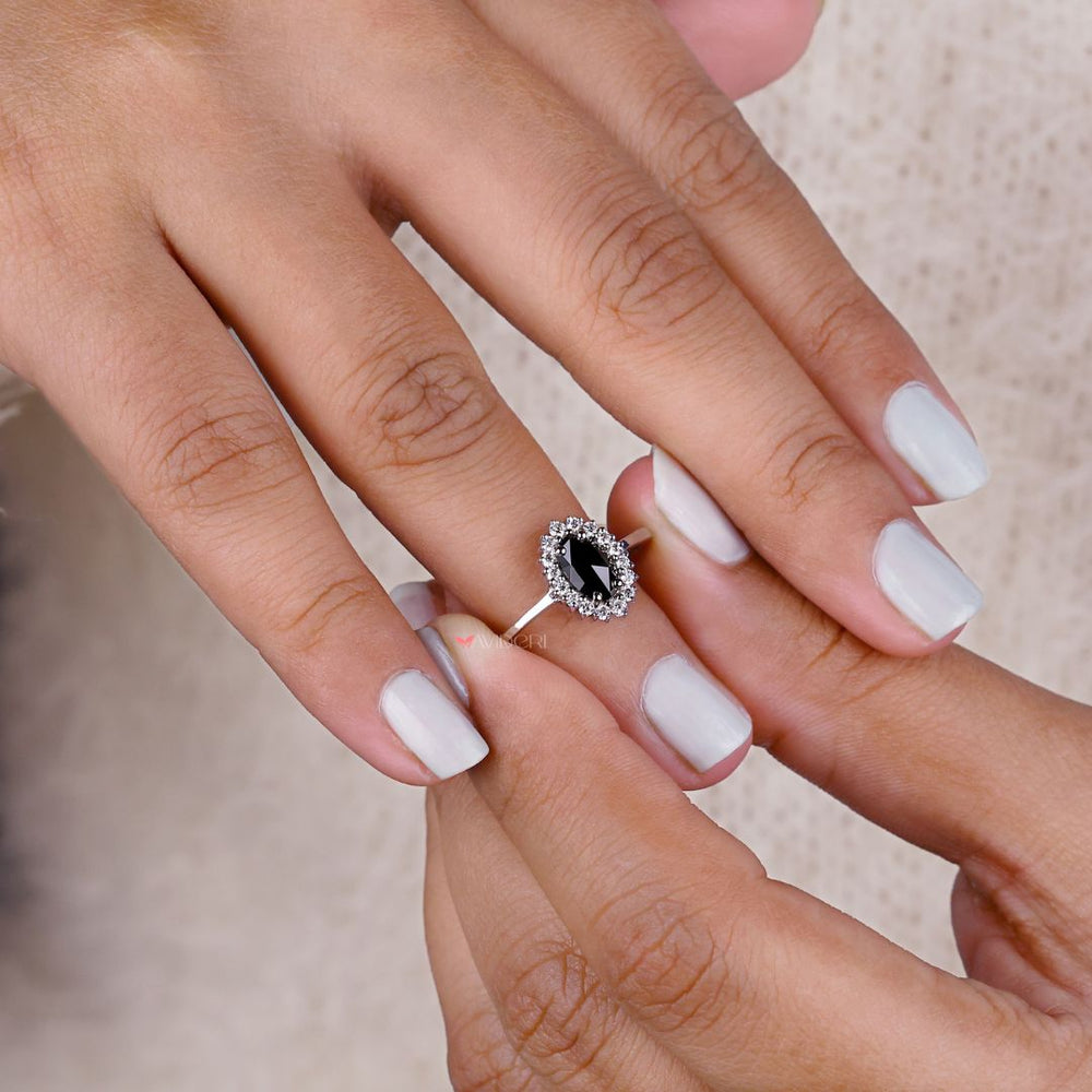 Halo engagement ring featuring a stunning oval cut moissanite centerpiece.
