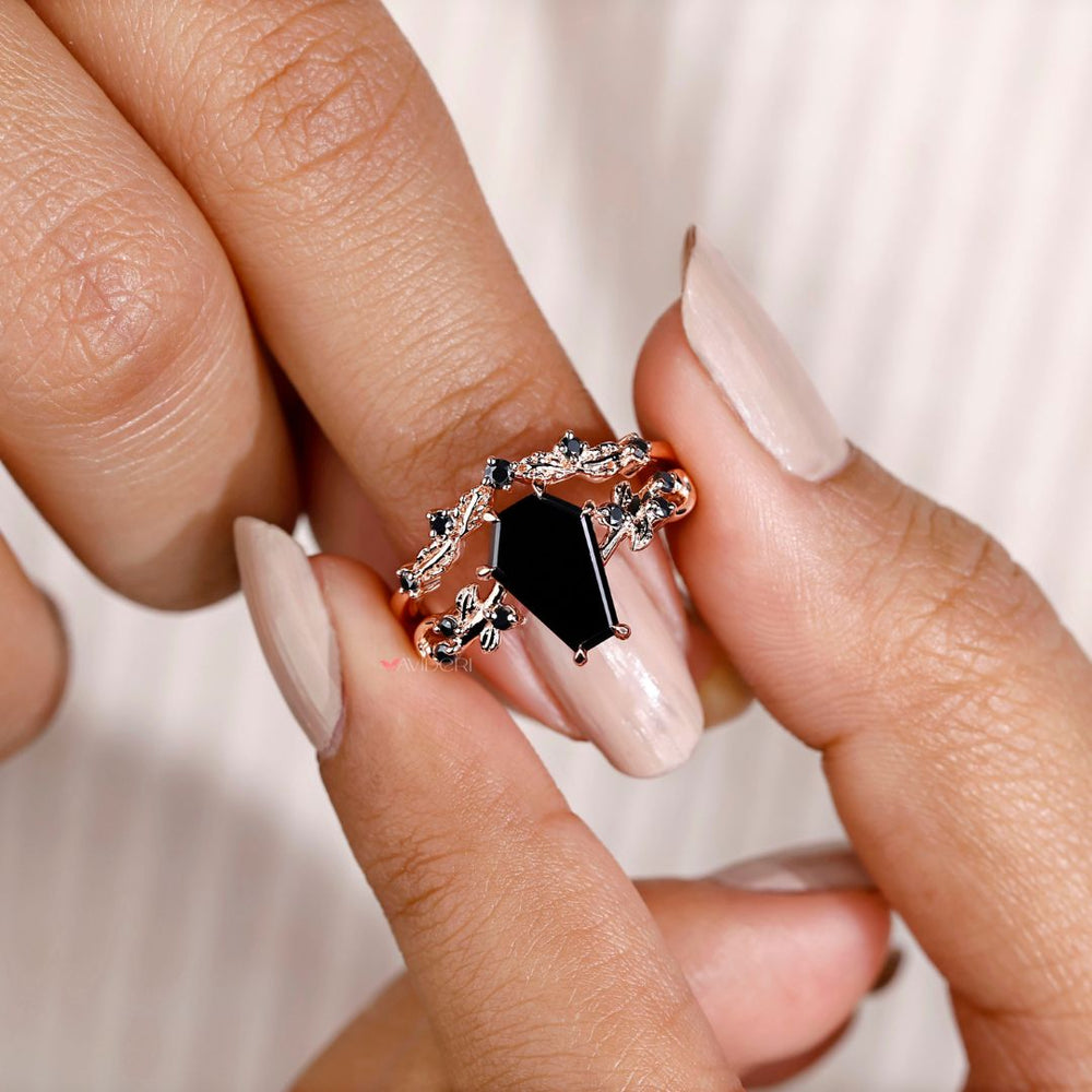 Black onyx engagement ring featuring intricate filigree design.