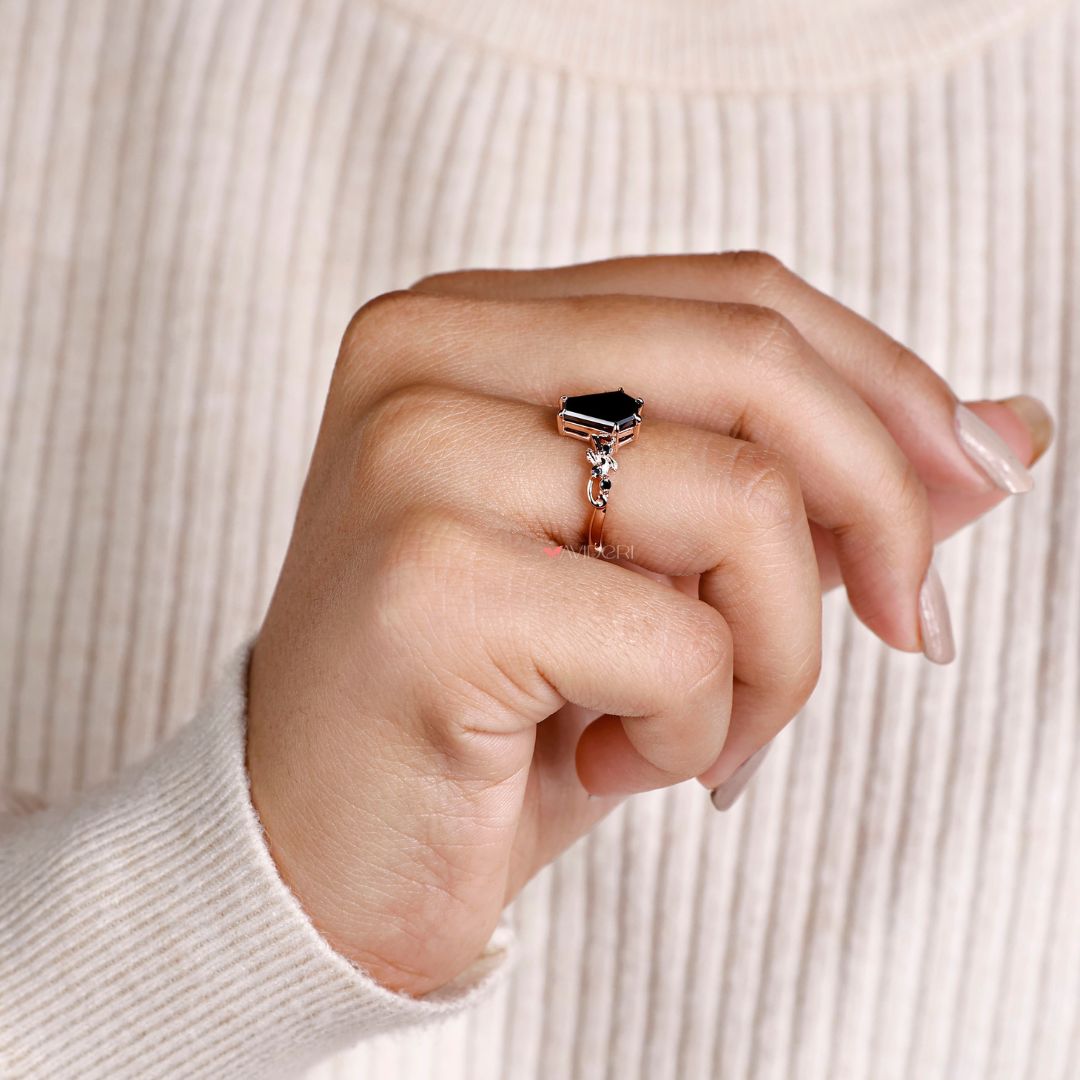 rose gold engagement ring featuring a striking coffin cut design.
