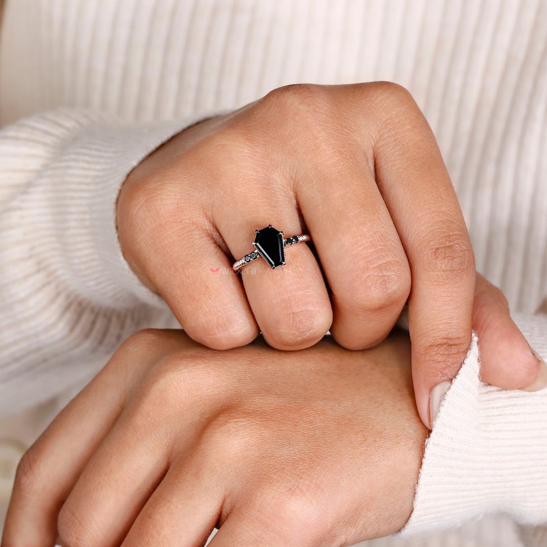 Avideri engagement ring featuring a unique coffin ring design with a round cut stone.
