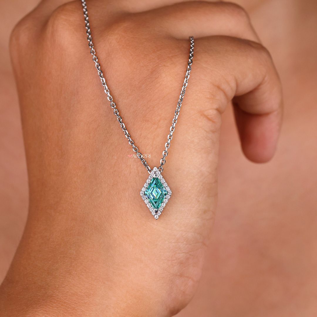 Round halo pendant with a lozenge cut moissanite stone.
