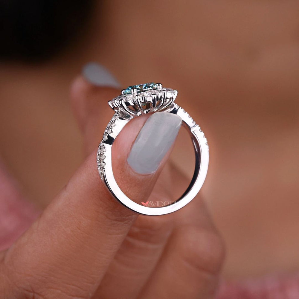 Twisted pave ring set with a round cut engagement ring and a halo engagement ring.
