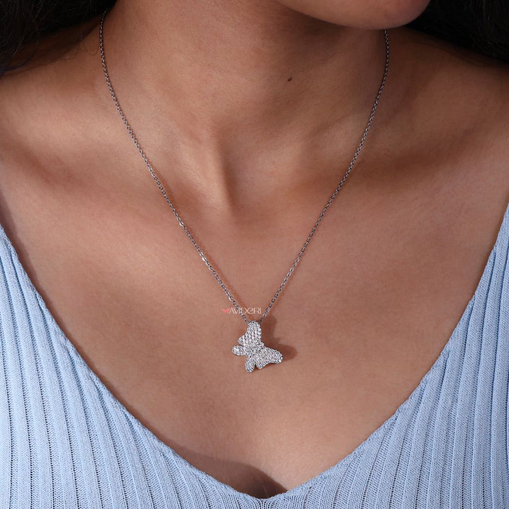 Handmade jewelry with butterfly and diamond elements

