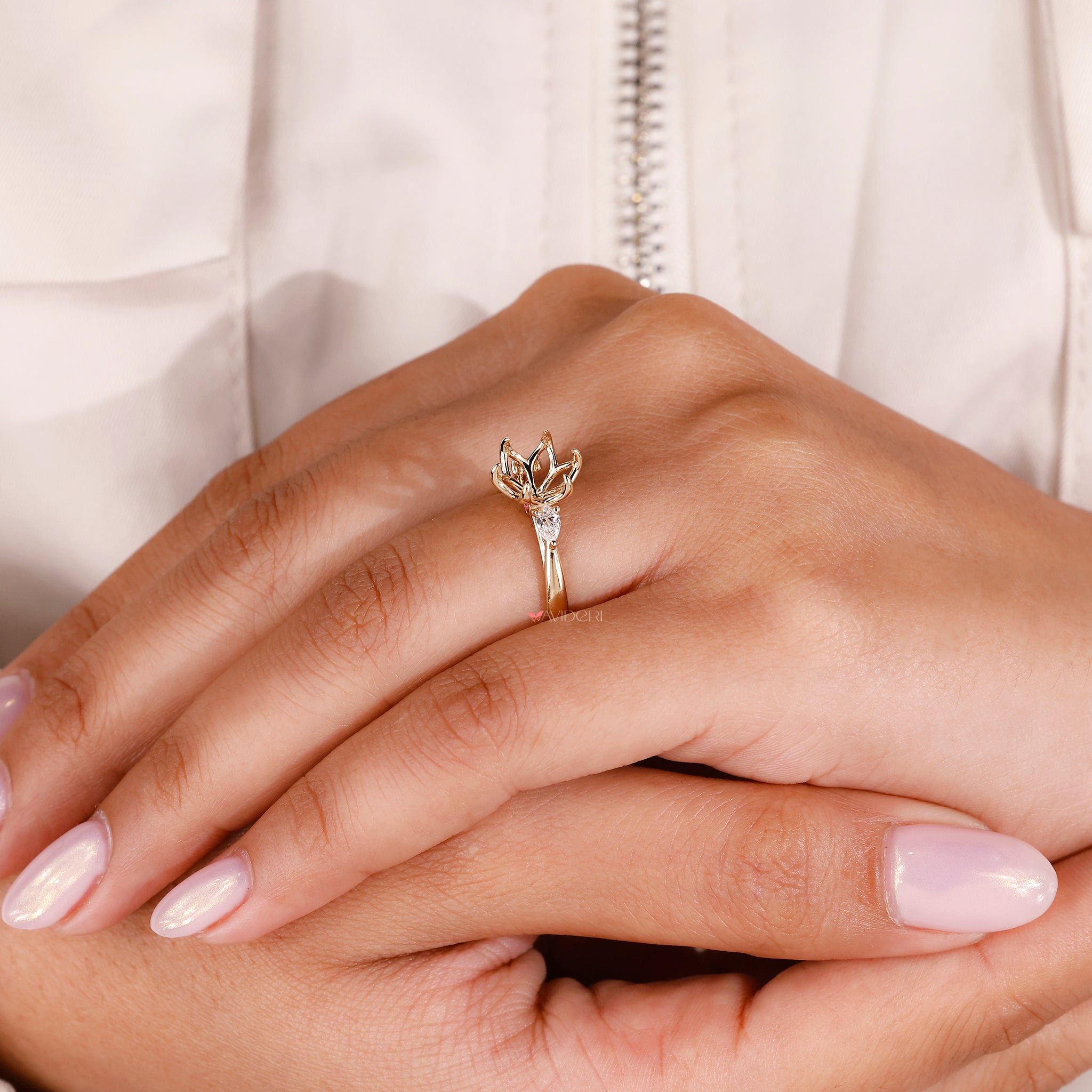 Yellow gold engagement ring with peekaboo setting and custom diamond design.
