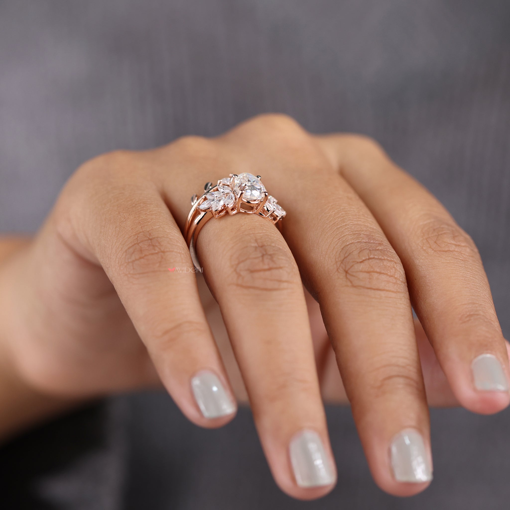 Leaf style wedding band with oval and marquise cut stones.
