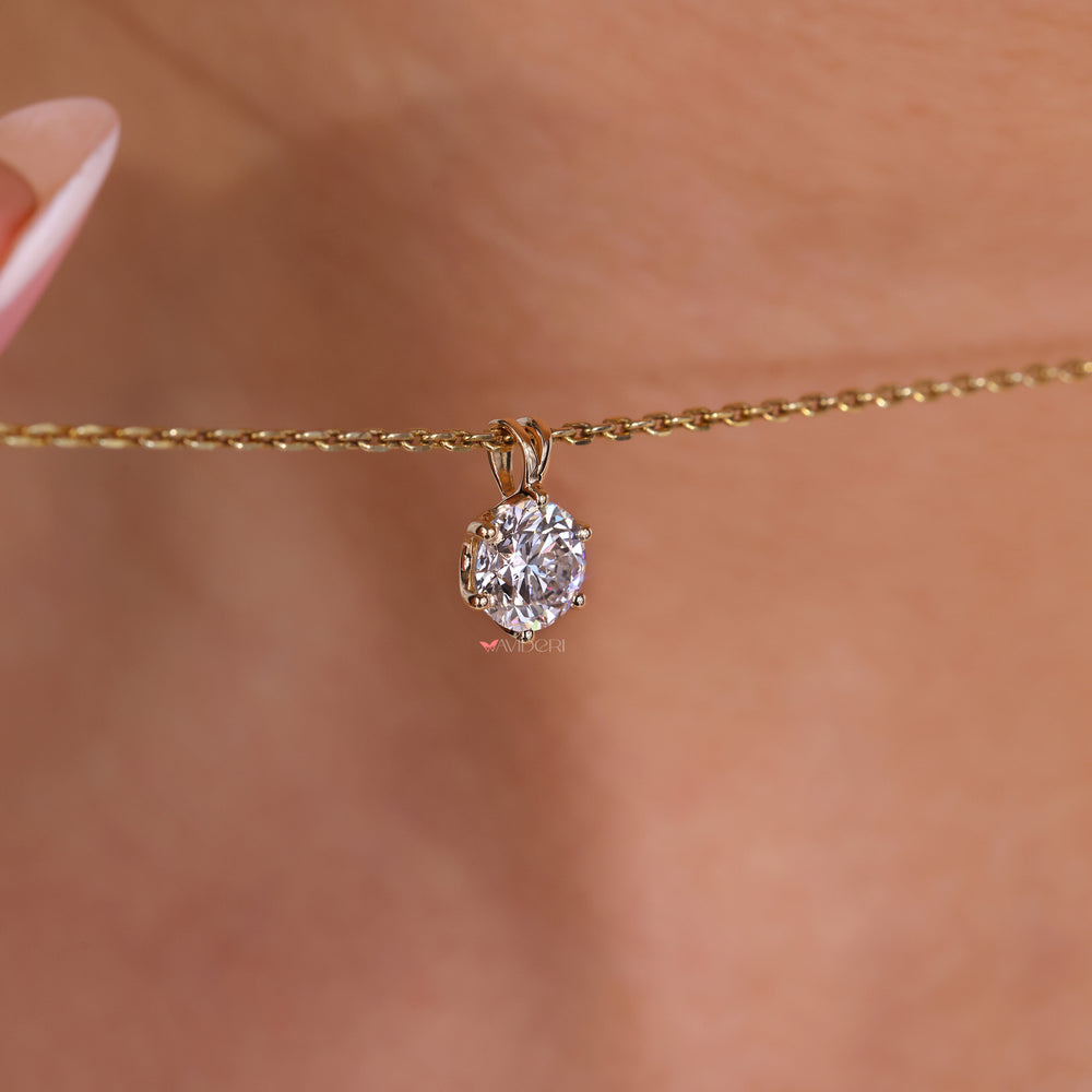 Solitaire diamond pendant in a classic setting.
