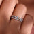 Wedding band with round diamonds set in a beautiful pattern.
